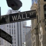 Wall Street opens flat as tariff jitters weigh on sentiment; Dow slips into red