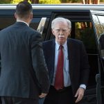 John Bolton surrenders to face charges of sharing classified information